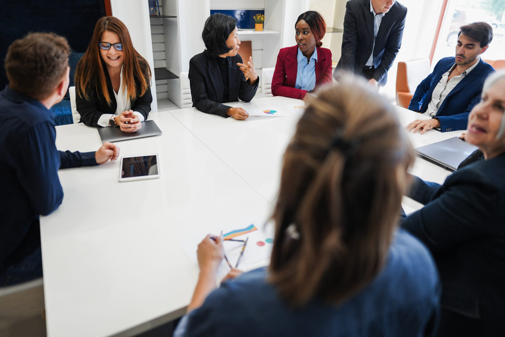 multigenerational-colleagues-working-inside-business-office-en