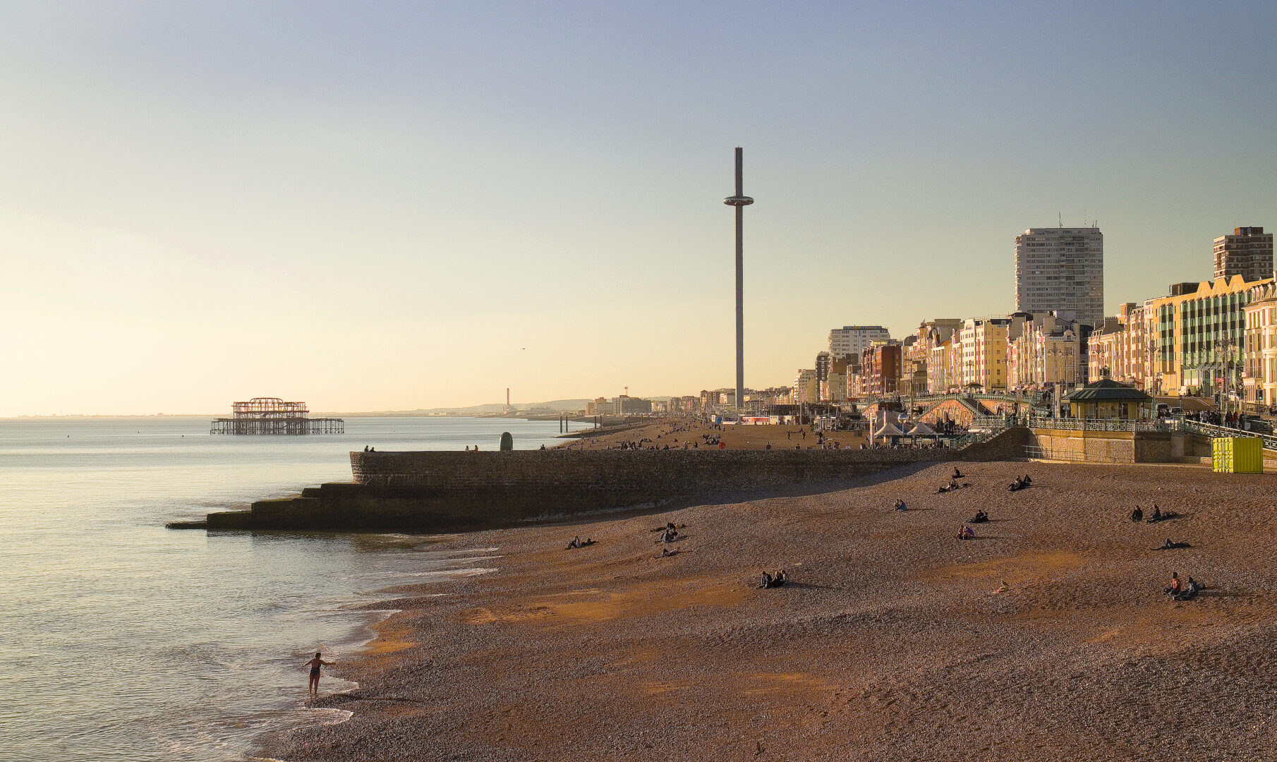 panoramic-view-sea-buildings-against-sky-sunset